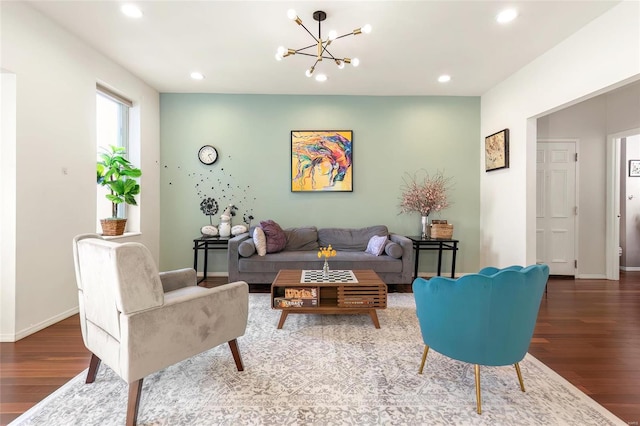 living area featuring an inviting chandelier, wood finished floors, and recessed lighting