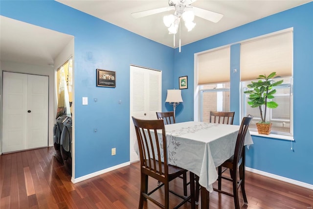 dining space featuring ceiling fan, baseboards, dark wood-type flooring, and independent washer and dryer