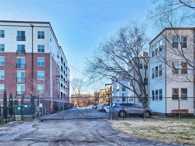 view of road featuring driveway and a gated entry