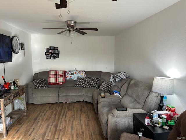 living area with ceiling fan and wood finished floors