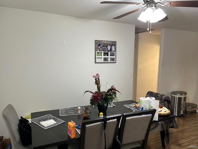 dining space featuring ceiling fan and wood finished floors