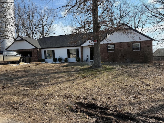 ranch-style home featuring brick siding and crawl space