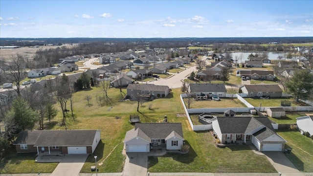 bird's eye view with a residential view and a water view