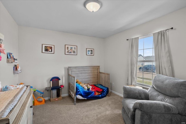 bedroom with carpet floors and baseboards