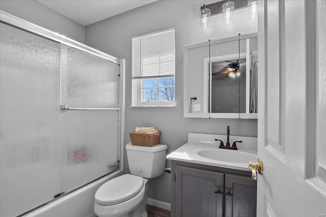 full bathroom with toilet, shower / bath combination with glass door, and vanity