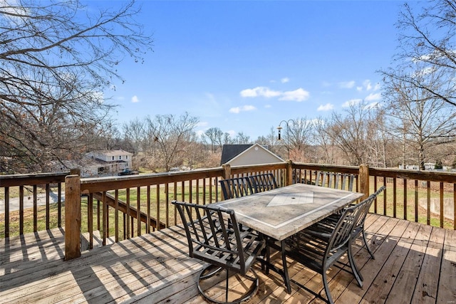 wooden terrace featuring outdoor dining area