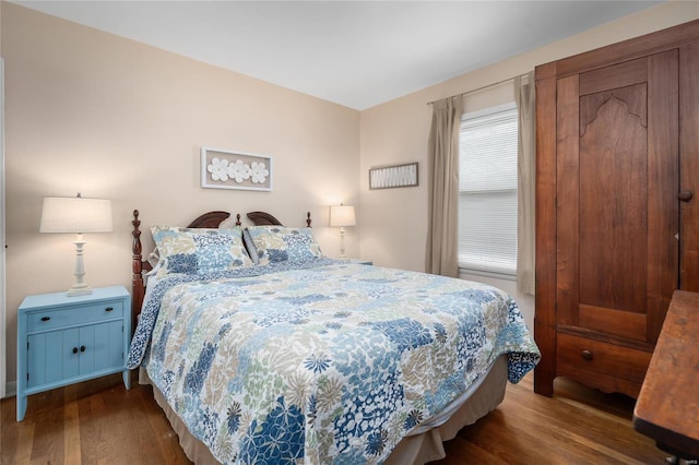 bedroom with wood finished floors