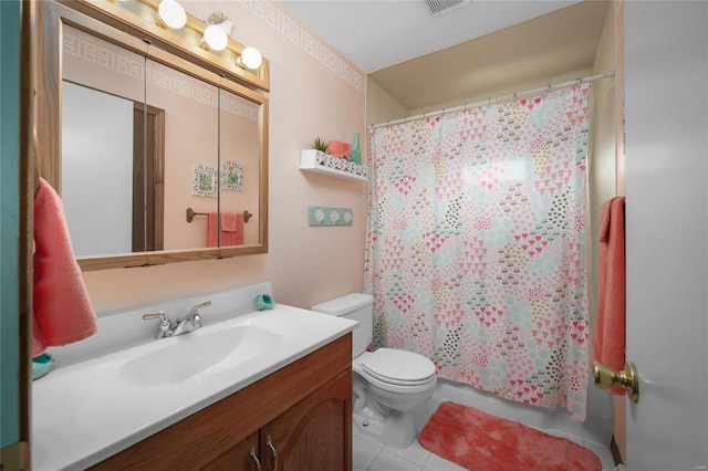 full bathroom featuring vanity, toilet, and visible vents