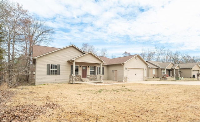 ranch-style house with an attached garage, stone siding, a porch, and concrete driveway