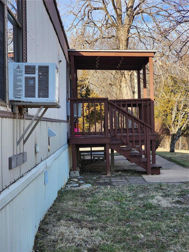 view of home's exterior featuring a deck and cooling unit