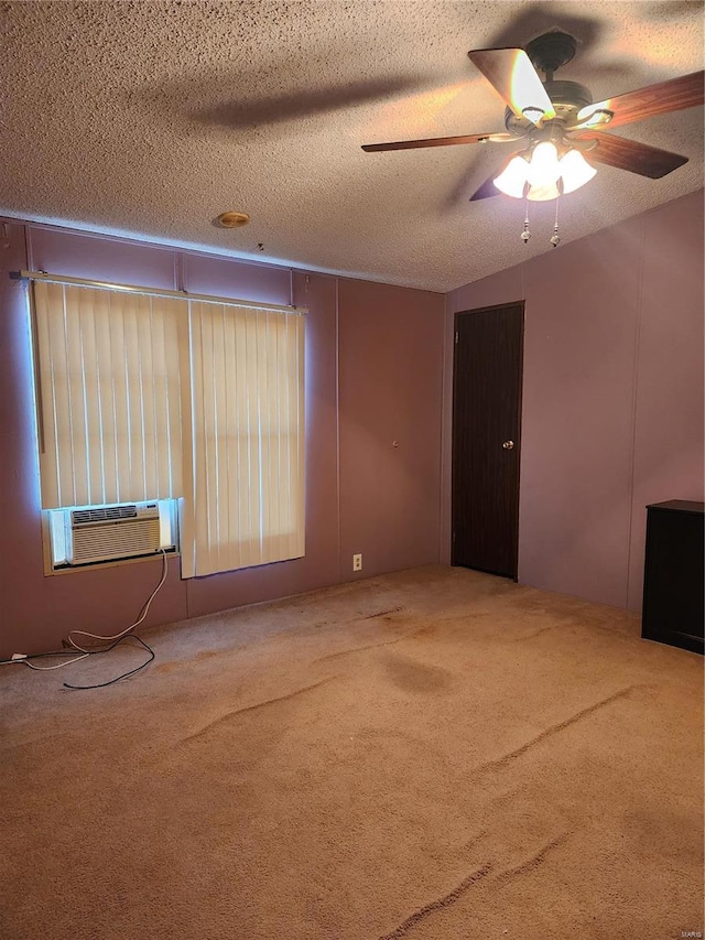 unfurnished living room featuring carpet floors, ceiling fan, and a textured ceiling