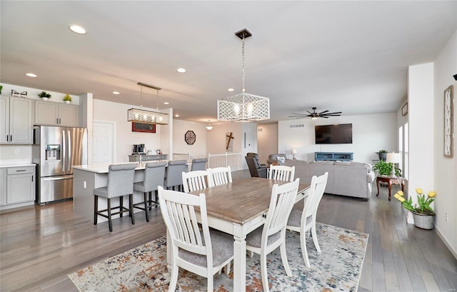 dining room with recessed lighting, wood finished floors, and ceiling fan