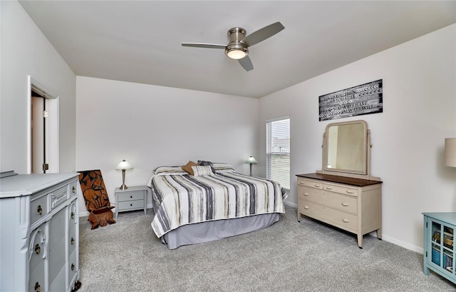 bedroom with baseboards, light colored carpet, and ceiling fan