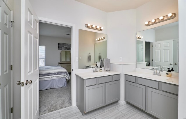 ensuite bathroom with two vanities, ensuite bathroom, and a sink