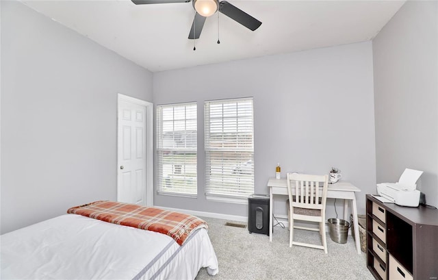 bedroom with visible vents, baseboards, carpet, and a ceiling fan