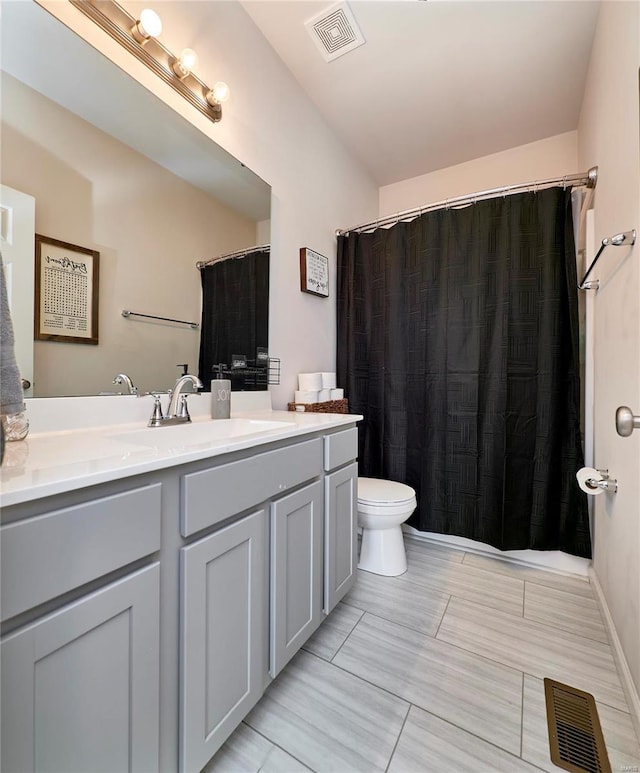 full bath with visible vents, toilet, and vanity