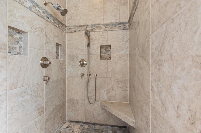 full bath with tiled shower