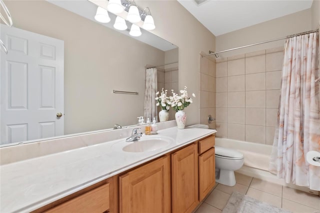 bathroom featuring tile patterned floors, toilet, vanity, and shower / bath combo