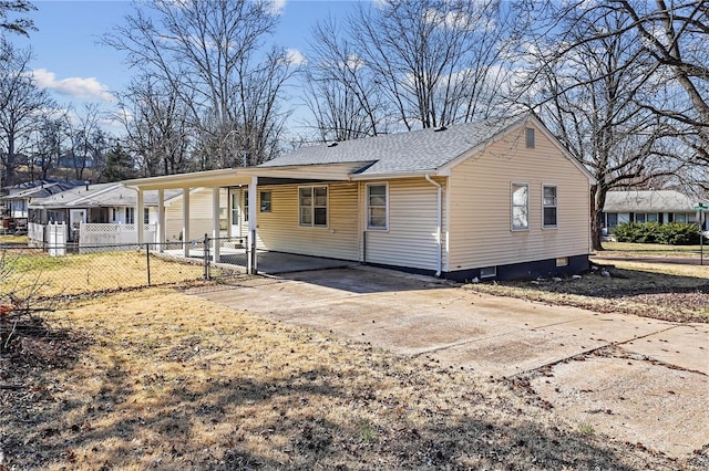 back of house with fence