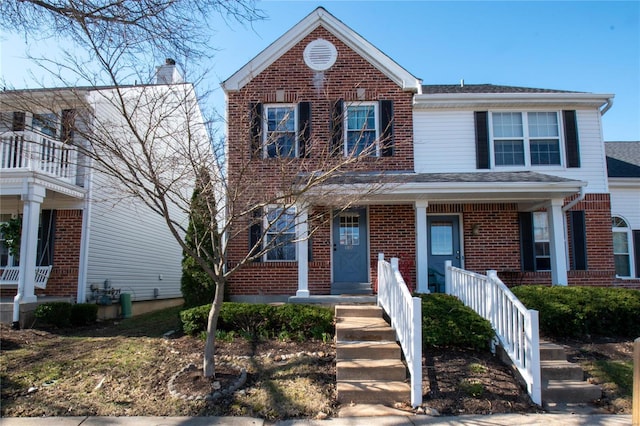 traditional-style home with brick siding