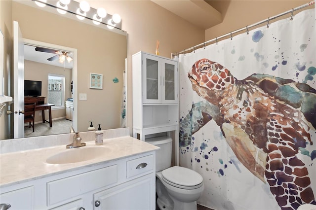 full bathroom with toilet, ceiling fan, and vanity