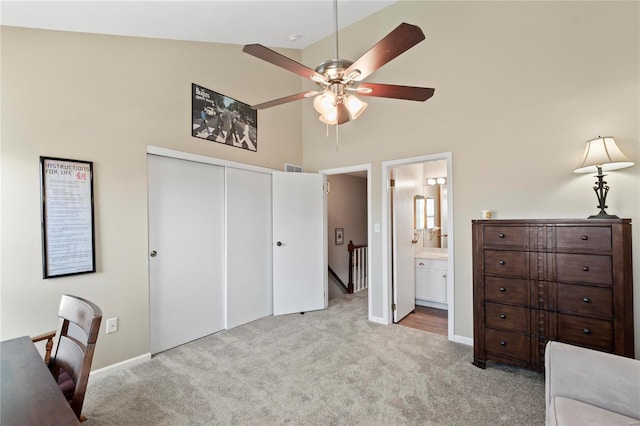 bedroom featuring carpet, visible vents, high vaulted ceiling, a closet, and ensuite bathroom