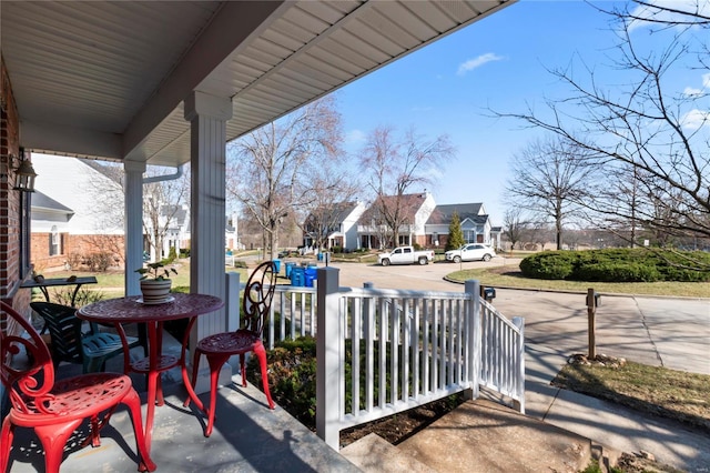 view of patio with a residential view and covered porch