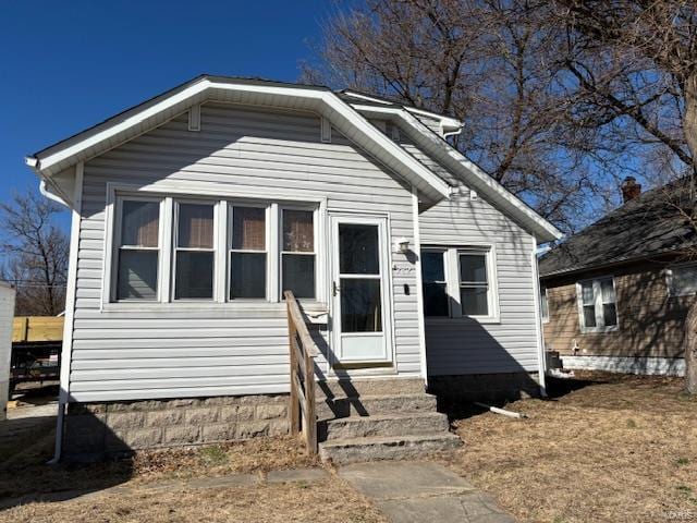 bungalow-style house featuring entry steps