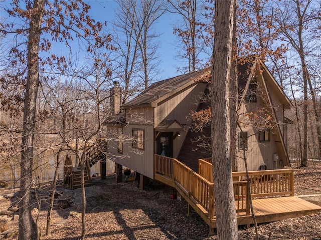 view of side of home featuring a chimney