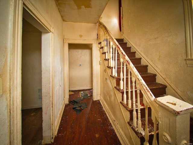 hallway with stairway and wood finished floors