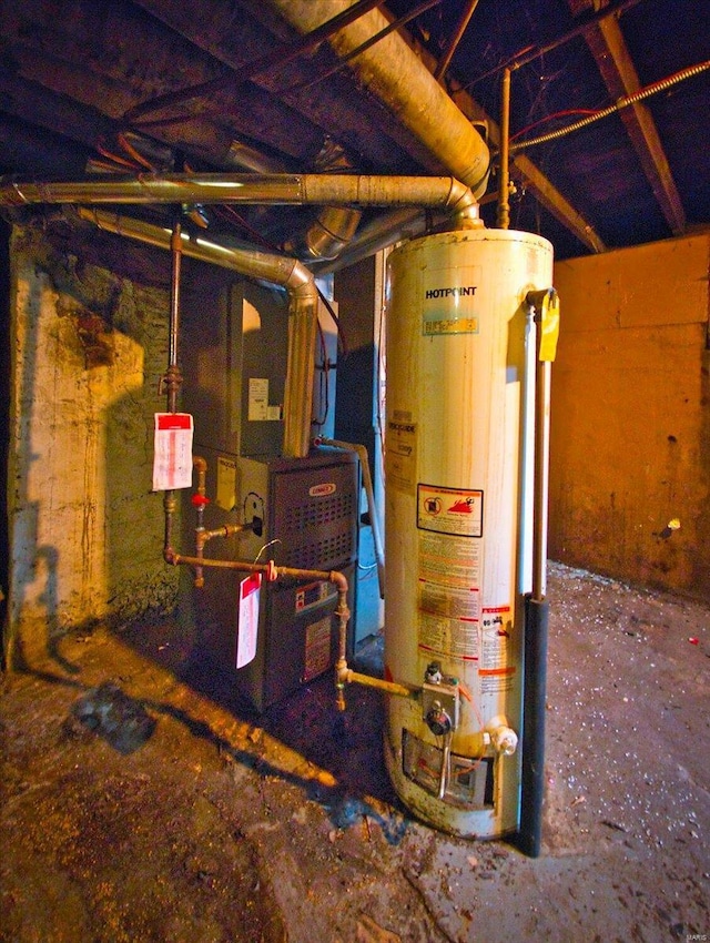 utility room featuring gas water heater