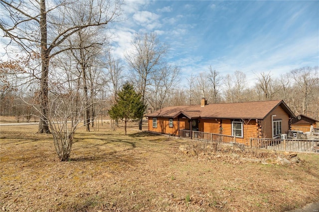 exterior space with a chimney and a porch