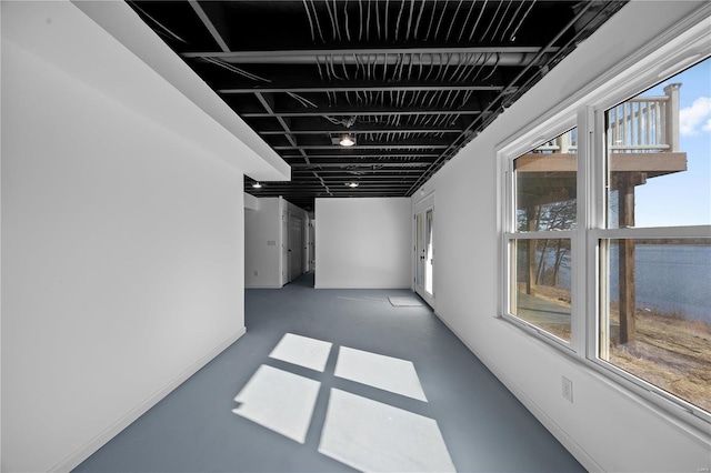 hallway with concrete floors