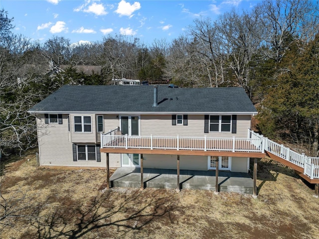 back of house featuring a patio area and a deck