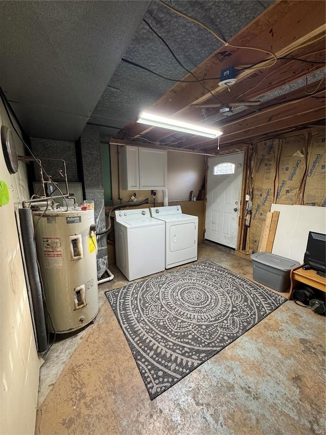 unfinished basement featuring washing machine and dryer and electric water heater