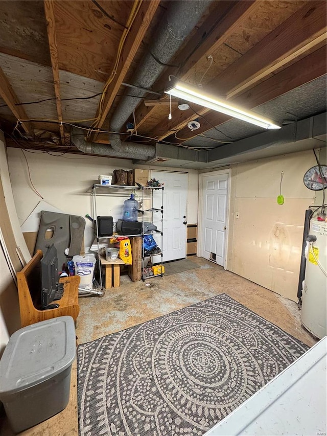 unfinished basement featuring gas water heater