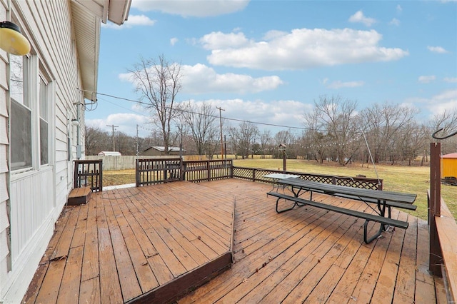 wooden terrace with a yard