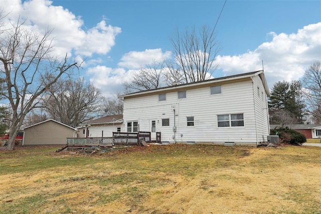 rear view of property featuring central AC, a lawn, and a wooden deck