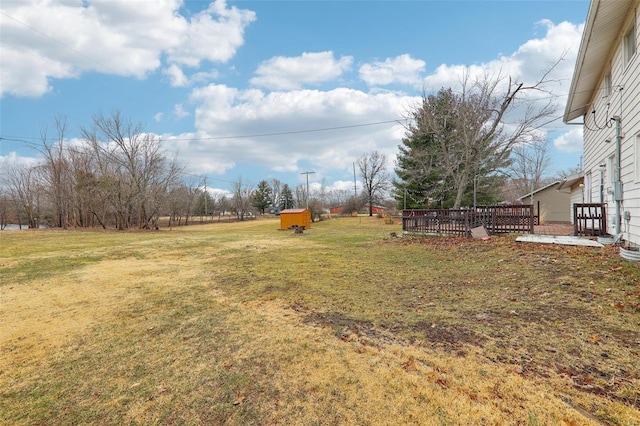 view of yard featuring a wooden deck