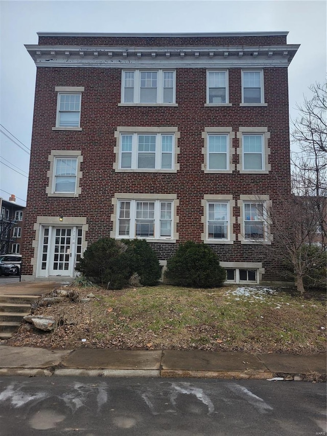 view of front of property featuring brick siding