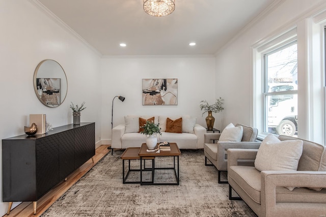 living area featuring recessed lighting, light wood-type flooring, baseboards, and ornamental molding