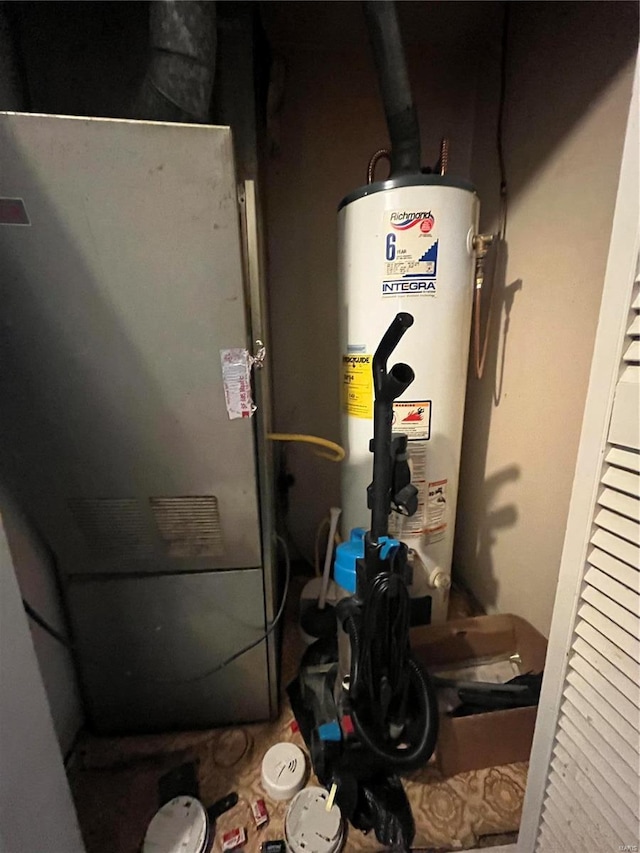 utility room featuring gas water heater