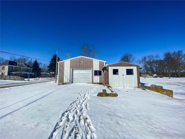 exterior space featuring an outbuilding and a detached garage