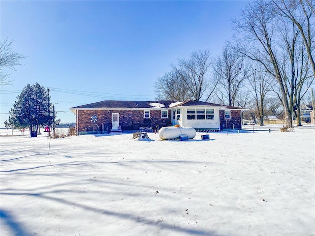 view of front of property featuring brick siding