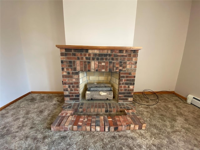 interior details featuring a baseboard heating unit, a brick fireplace, carpet flooring, and baseboards