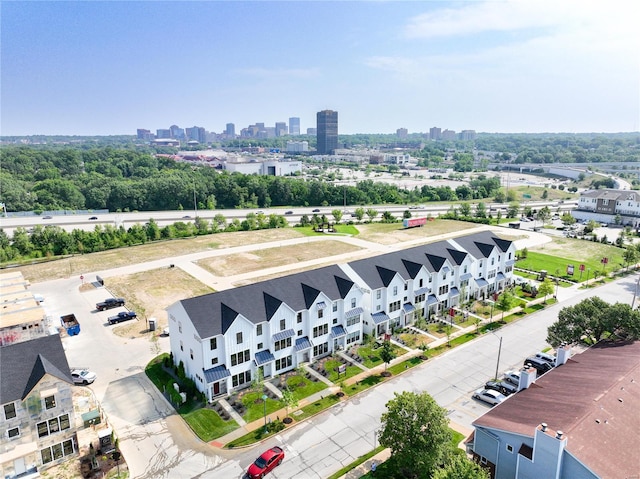 birds eye view of property with a view of city