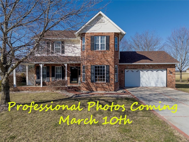 traditional home with a porch, a garage, brick siding, a shingled roof, and concrete driveway