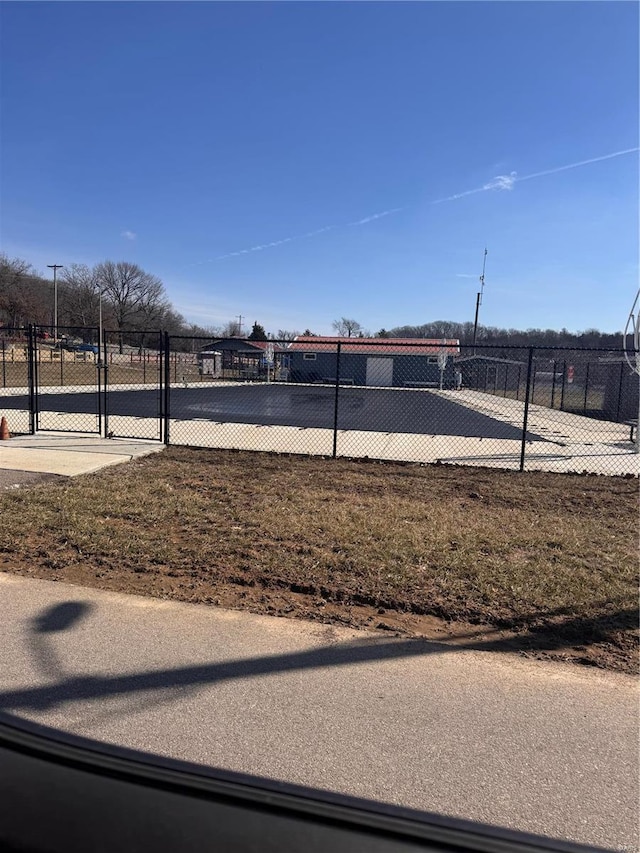 surrounding community with a gate and fence