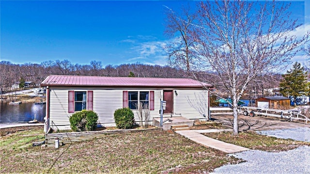 view of front of home featuring metal roof