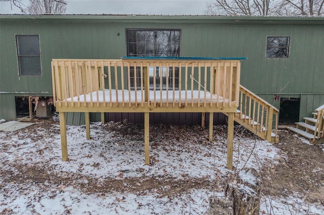 exterior space featuring stairs, metal roof, and a wooden deck